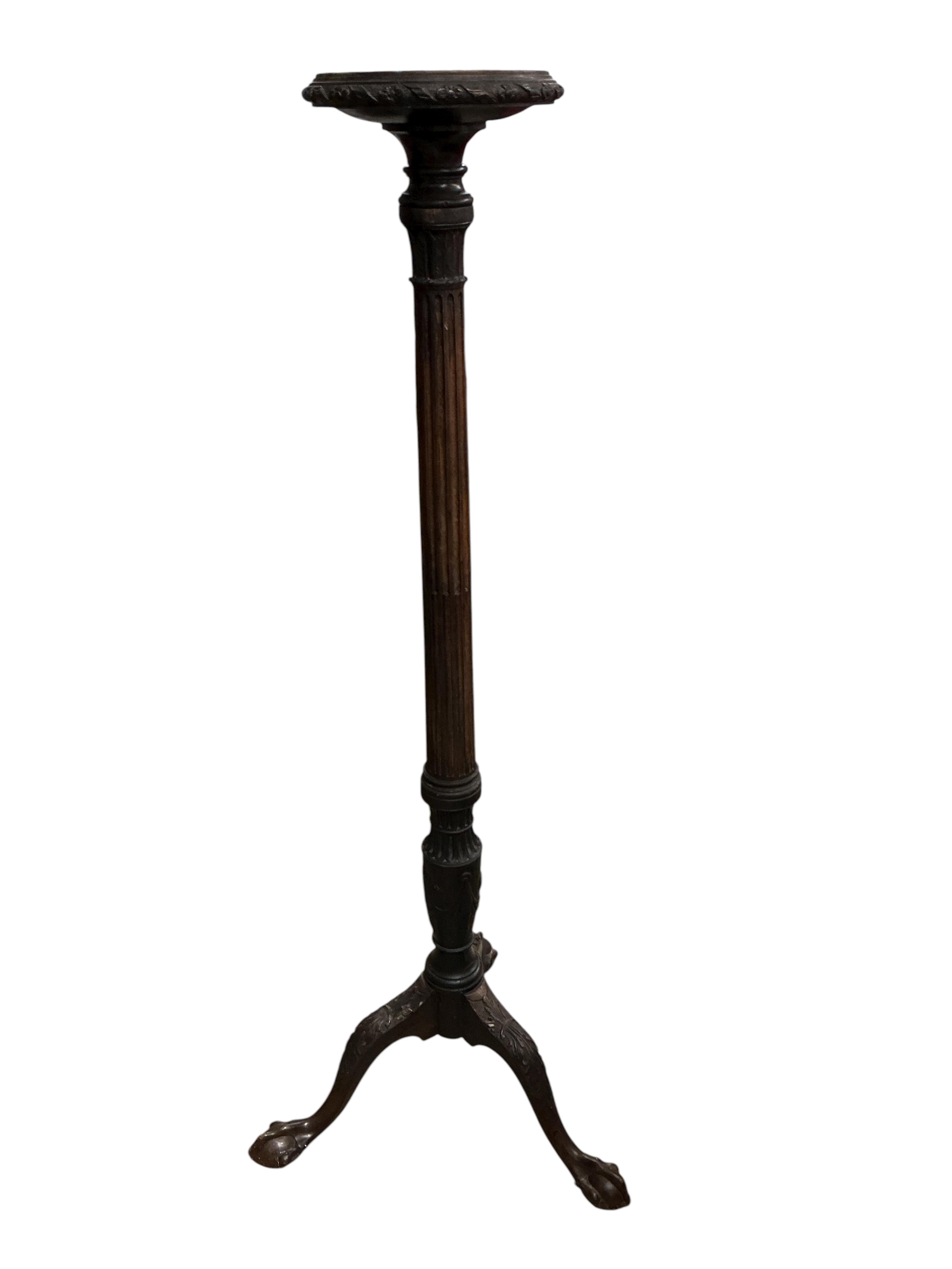 An early 20th century Chippendale Revival mahogany torchere, height 146cm